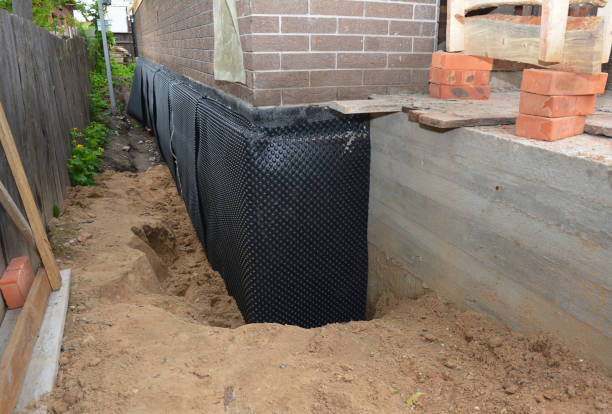 Happy homeowners after waterproofing job in Bourneville